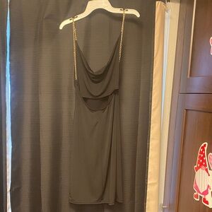 Elegant Black Draped Dress with Gold Chain Straps